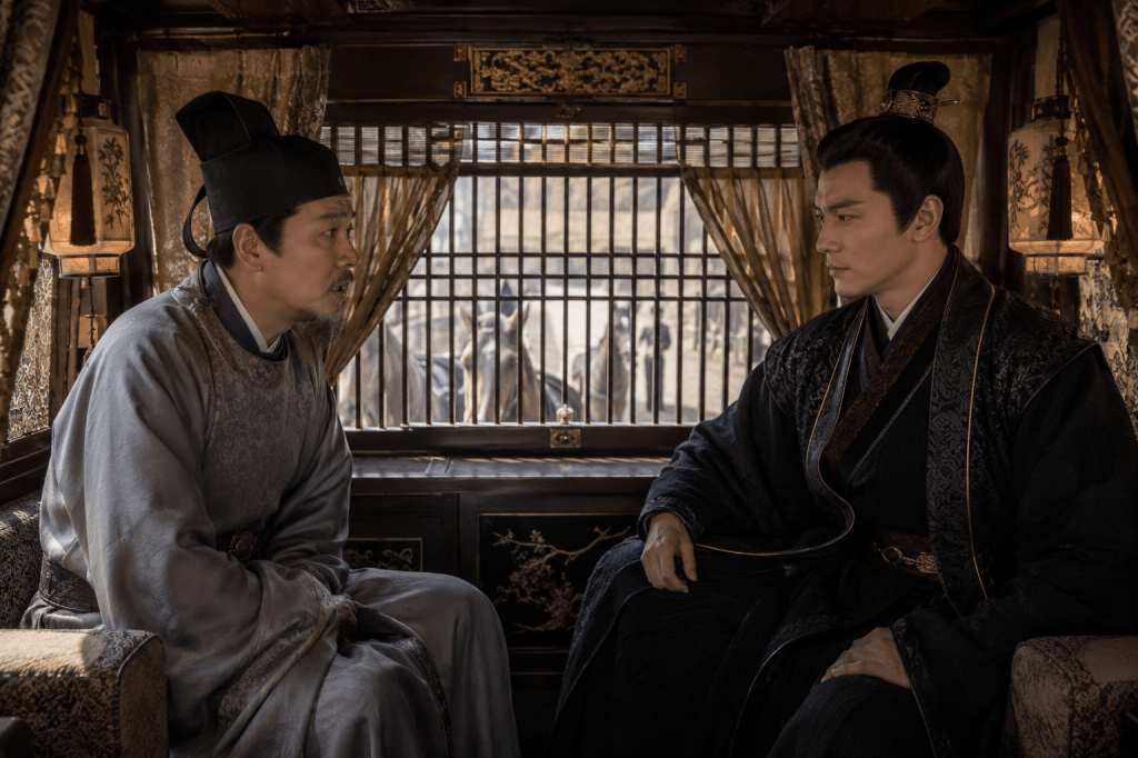 Zhōu Shūrén sits inside a horse carriage facing Bai Jǔrén during a tense confrontation in Journey of the Peasant Mother-in-Law Chapter 429.
